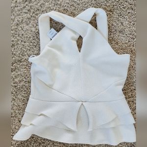 NWT- Bebe - sexy white peplum top. Size S